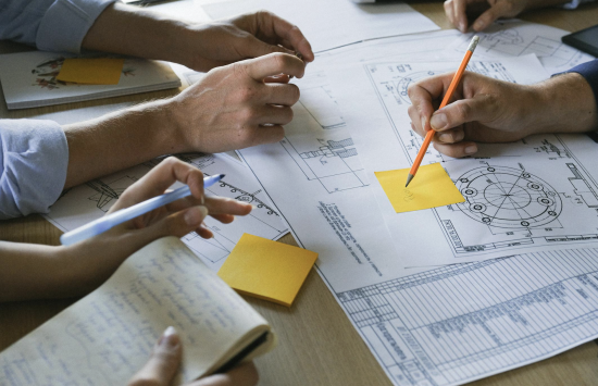 Construction project meeting discussing owner's rep brief